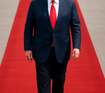 Donald Trump walks on a red carpet during his formal arrival for the Donald Trump state visit UK.